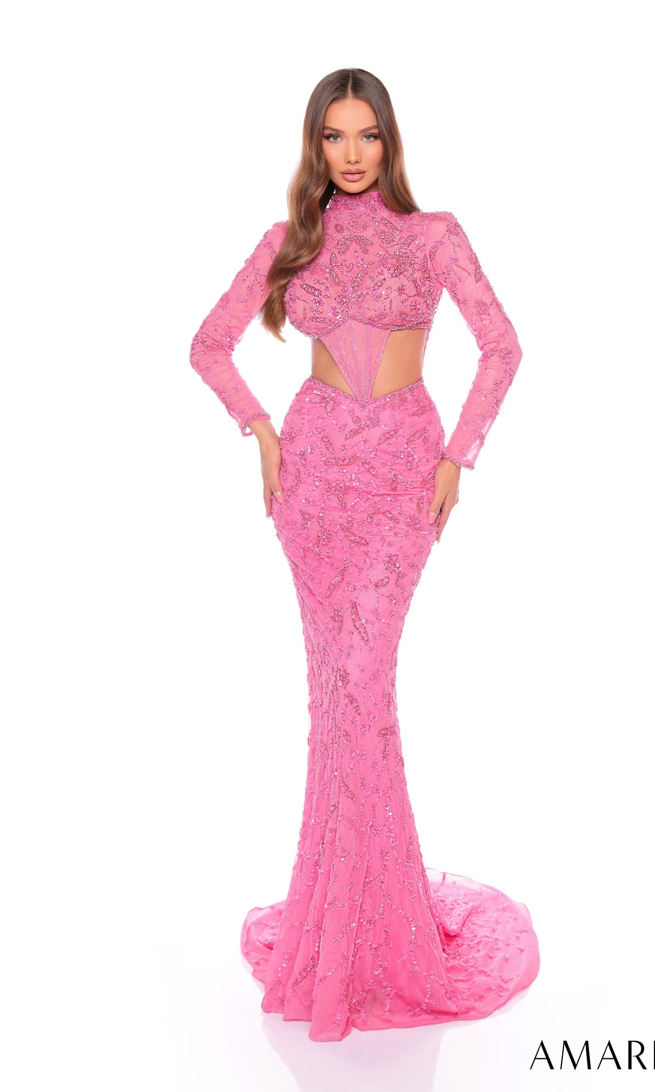 A woman stands against a white background wearing the Long Formal Dress 88089 by Amarra, featuring a fitted silhouette, long sleeves, high neck, pink sequins, and sheer cut-out accents at the midriff.
